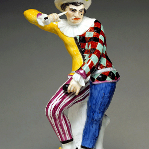An angry harlequin figurine