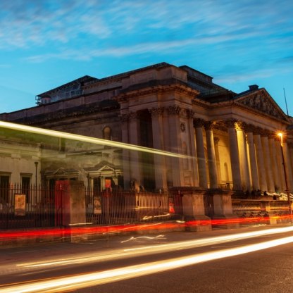 Evening photograph of the exterior of Fitzwilliam Museum with light streaks